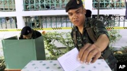 FILE - A Thai soldier casts his vote during the general election at a polling station in Bangkok, Thailand, Feb. 2, 2014.