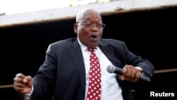 FILE - Former South African president Jacob Zuma dances as he addresses supporters outside the high court in Durban, South Africa, June 8, 2018.