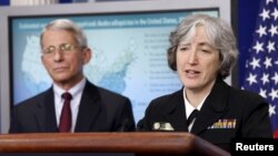FILE - Dr. Anne Schuchat, principal deputy director for Centers of Disease Control Prevention, right, and Dr. Anthony Fauci, director of the National Institute for Allergy and Infectious Disease, speak at the White House in Washington, April 11, 2016.