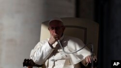 Pope Francis listens to the welcome speeches during his weekly general audience in St. Peter's Square at the Vatican, Wednesday, Oct. 24, 2018.