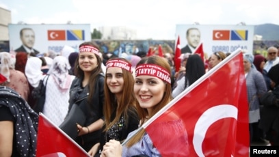 FILE - Supporters of Turkish President Recep Tayyip Erdogan gather before a pre-election rally in Sarajevo, Bosnia and Herzegovina, May 20, 2018.