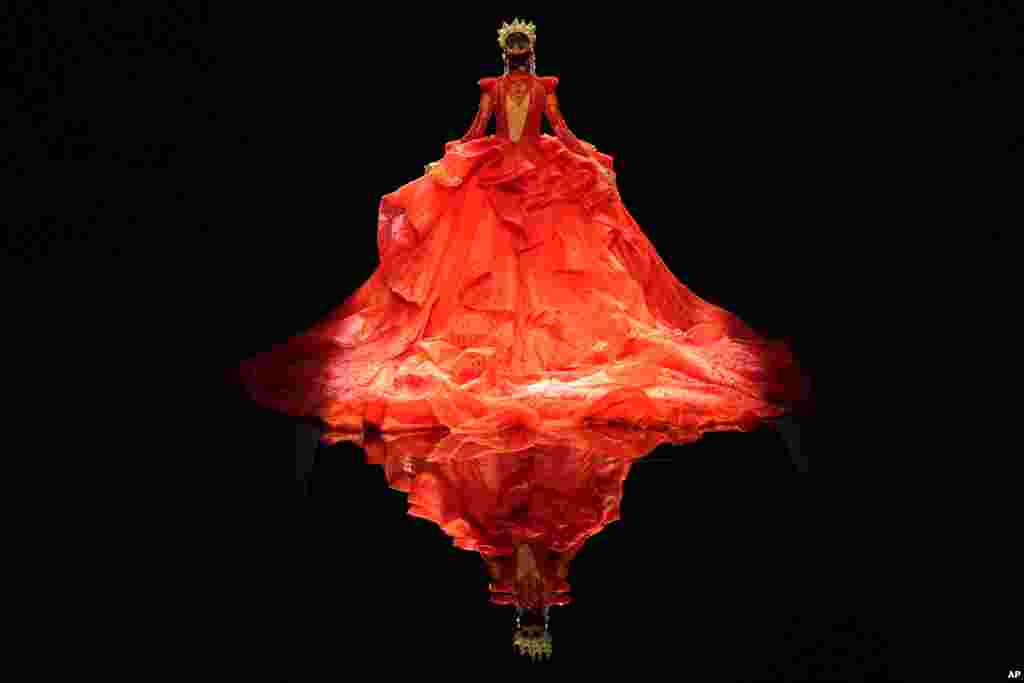 A model presents a gown from the William Zhang collection by designer Hongwei Zhang during the China Fashion Week held in Beijing.