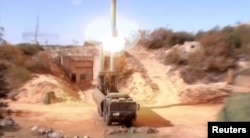 A still image taken from a video footage and released by Russia's Defence Ministry, Nov. 15, 2016, shows Russian Bastion coastal missile launchers launching Oniks missiles at an unknown location in Syria.