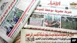Egyptian newspapers publish front page pictures of Ilan Grapel, as Egypt's state security prosecution began questioning the Israeli man suspected of spying for the Mossad intelligence, June 13, 2011.
