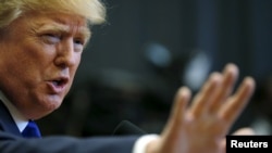 FILE - U.S. Republican presidential candidate Donald Trump quiets a reporter during a news conference before a campaign town hall meeting in Derry, New Hampshire, Aug. 19, 2015. 