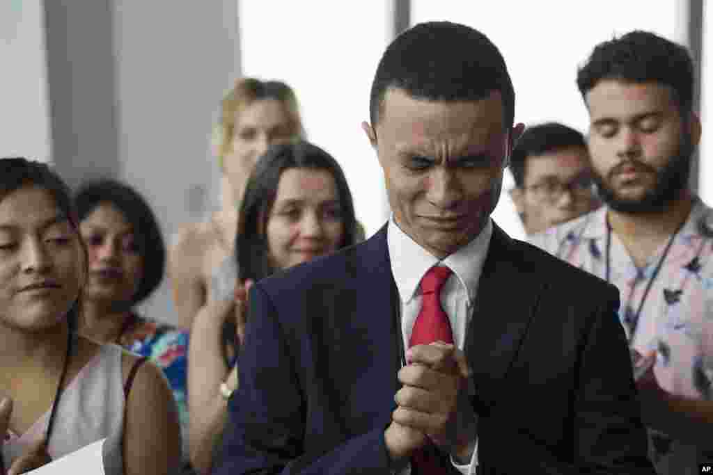 Gleidson Hoffman, from Brazil, becomes emotional during his naturalization ceremony in New York. The U.S. Citizenship and Immigration Services offered the ceremony for 30 people from 19 countries.