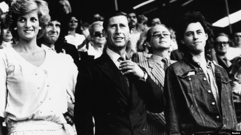 Diana, Princess of Wales, and Prince Charles stand with Bob Geldof in the Royal Box at Wembley Stadium at the start of the Live Aid charity concert in London, July 13, 1985.