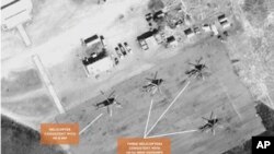 Satellite image of helicopters at the Sudanese airbase at Kidugli.
