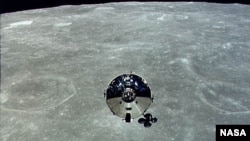 The Apollo 10 command module is seen orbiting the moon during its 1969 mission. 