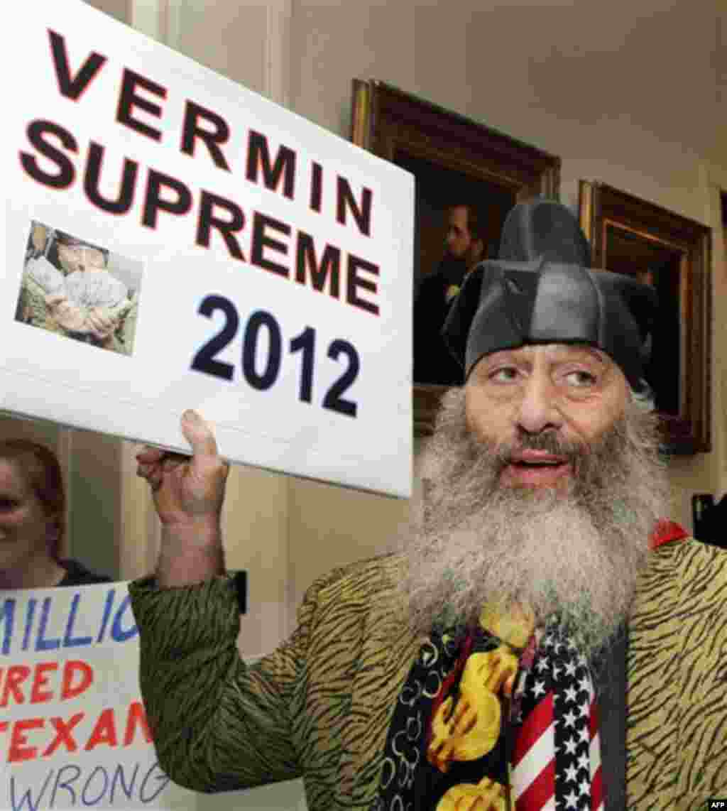 In this Oct. 28, 2011 photo, Vermin Supreme gets ready to file at the Secretary of State's office in Concord, N.H., to be on the ballot for the First-in-the-Nation presidential primary. Forty candidates, from President Barack Obama to a Delaware man who's