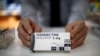 Kotak obat Ivermectine, buatan Biogaran, terlihat di loket apotek, saat penyebaran COVID-19 berlanjut, di Paris, Perancis, 28 April 2020. (Foto: REUTERS/Benoit Tessier)