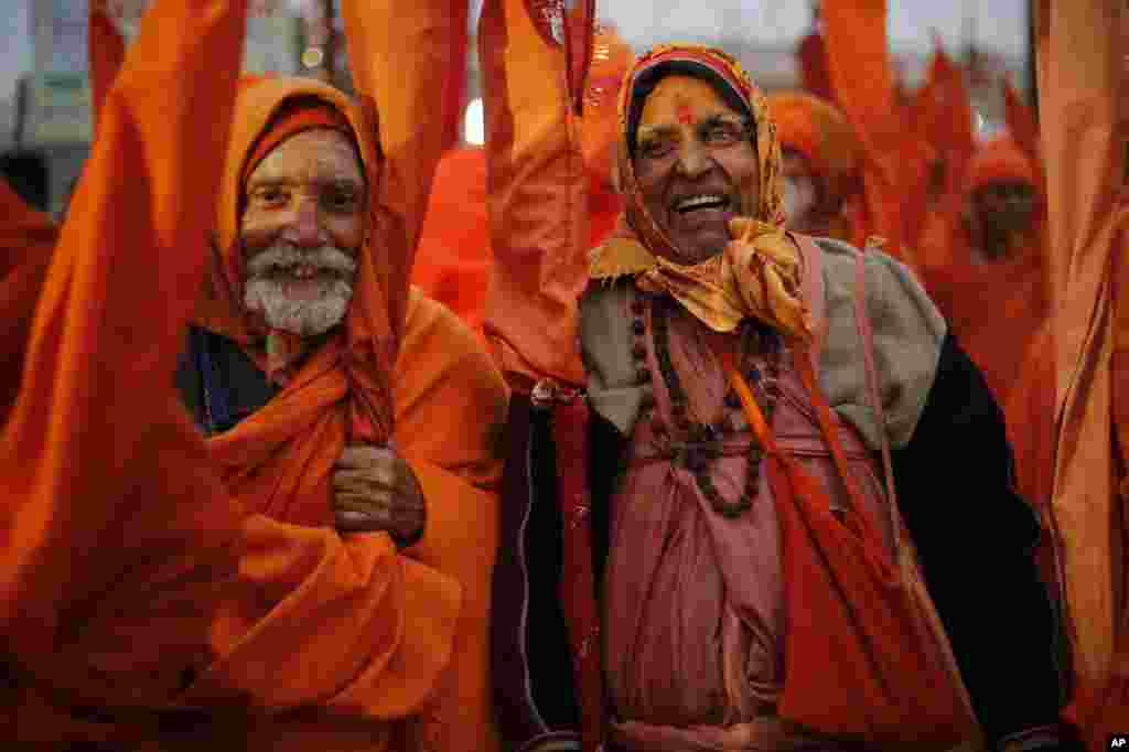 Indian Sadhus, or Hindu holy men, participate in a community feast at the Sangam, the confluence of the Rivers Ganges, Yamuna and mythical Saraswati, during the annual month-long Magh Mela religious fair in Allahabad.