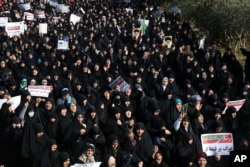 Iranian protesters chant slogans at a rally in Tehran, Iran, Dec. 30, 2017. Iranian hard-liners rallied to support the country's supreme leader and clerically overseen government as spontaneous protests sparked by anger over the country's ailing economy.