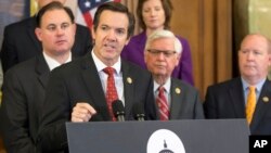 In this May 13, 2016, file photo, Rep. Evan Jenkins, R-W. Va., is joined by other House Republicans as he talks about legislation passed to combat opioid addiction on Capitol Hill in Washington. 