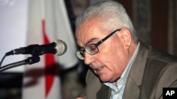 In this undated photo released Aug. 18, 2015 by the Syrian official news agency SANA, one of Syria's most prominent antiquities scholars, Khaled al-Asaad, speaks in Syria. 