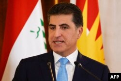 FILE - Nechirvan Barzani, president of Iraq's autonomous Kurdistan Region, speaks at a press conference in Arbil, the capital of northern Iraq's Kurdistan autonomous region, Aug. 29, 2021.