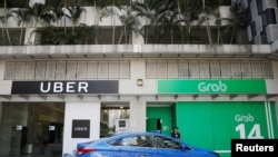 Uber và Grab ở Singapore.
