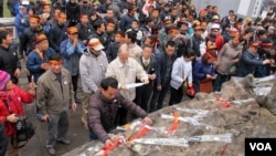 Protesters lay wreaths at a pagoda on Hoan Kiem lake, Vietnam.