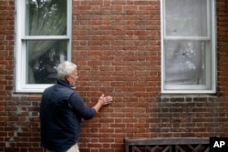 Michael McCrea shows where people have come to touch his house, the former home of Jacob and Hannah Leverton, once a key stopping point for slaves seeking sanctuary on the Underground Railroad in Preston, Maryland, May 12, 2017.