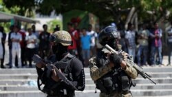 Officers with the General Security Unit of the National Palace (USGPN) secure a street at Champs de Mars before of Haitian president Jovenel Moise's convoy passes by, in Port-au-Prince, Haiti October 7, 2019