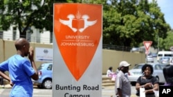 Students queue outside the University of Johannesburg to register for this year's studies, January 10, 2012.