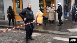 French police patrol near the Boulevard de Barbes in the north of Paris on Jan. 7, 2016, after police shot a man dead as he was trying to enter a police station in the nearby Rue de la Goutte d'Or.