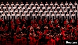 Performers sing during a concert on the eve of 70th anniversary of North Korea's founding in Pyongyang, Sept. 8, 2018.