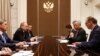 Russian President Vladimir Putin (2-L) meets with the President of the Asian Infrastructure Investment Bank (AIIB) Jin Liqun (2-R) in the Bocharov Ruchei residence in Sochi, Russia, May 18, 2016.
