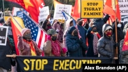 FILE: Members of the Tigray diaspora in North America protest about their conflict with Ethiopia, near the State Department in Washington on Wednesday, Dec. 22, 2021.