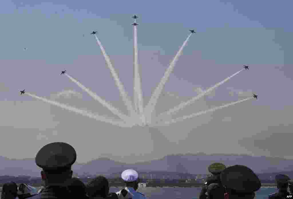 South Korean military officials watch a flypast as they participate in an exercise on the 73rd anniversary of Armed Forces Day in Pohang.