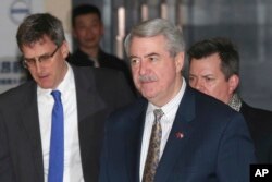 U.S. Undersecretary for Trade and Foreign Agricultural Affairs Ted McKinney, center, who is part of U.S. trade delegation leaves from a hotel for a second day of meetings with Chinese officials in Beijing, China, Jan. 8, 2019.