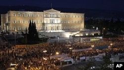 Demonstrators gather in front of the Parliament in Athens' main Syntagma Square, June 15, 2011