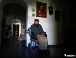 Francisco Nunez, 112, poses for a portrait at his home in Bienvenida, Badajoz, southern Spain, Dec. 11, 2016.