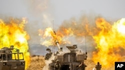 以色列砲兵部隊向加沙地帶目標開火。(2021年5月21日)
