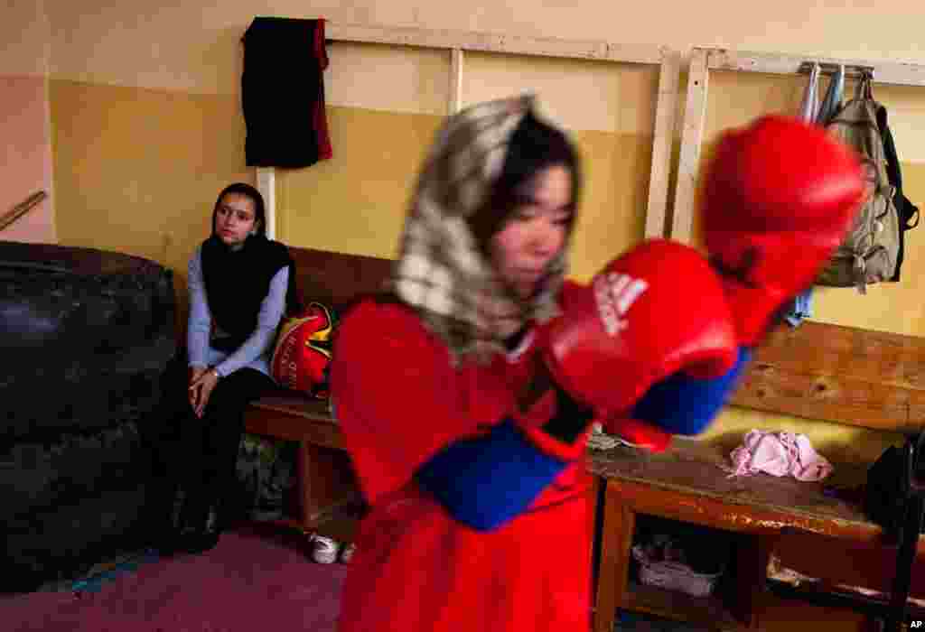 An Afghan woman practices inside a boxing club in Kabul, December 28, 2011. (Reuters)