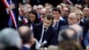 French President Emmanuel Macron attends a meeting with mayors from rural Normandy as part of the launching of the "Great National Debate" designed to find ways to calm social unrest in the country, in Grand Bourgtheroulde, France, Jan. 15, 2019. 