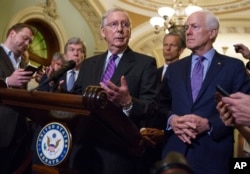 Senate Majority Leader Mitch McConnell, R-Ky., joined by Sen. Roy Blunt, R-Mo., left, Sen. John Thune, R-S.D., second from right, and Majority Whip John Cornyn, R-Texas, right, speaks with reporters about the confirmation for President Donald Trump's Supreme Court nominee, Brett Kavanaugh, following a closed-door GOP policy meeting, at the Capitol in Washington, Sept. 25, 2018.