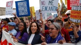 Democratic presidential candidate Sen. Kamala Harris, center left, D-Calif., marches with people protesting for higher minimum wage outside of McDonald's, Friday, June 14, 2019, in Las Vegas. (AP Photo/John Locher)