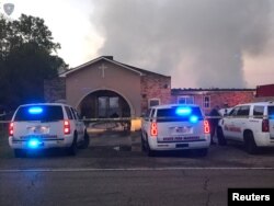 Louisiana State Fire Marshall vehicles are seen outside the Greater Union Baptist Church during a fire, in Opelousas, April 2, 2019, in this picture obtained from social media.