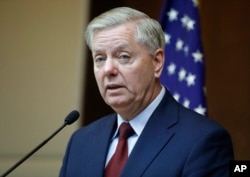 FILE - Republican Sen. Lindsey Graham speaks to reporters in Ankara, Turkey, Jan. 19, 2019.