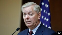 FILE - Republican Sen. Lindsey Graham speaks to reporters in Ankara, Turkey, Jan. 19, 2019.