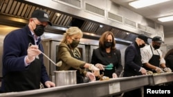 U.S. President Joe Biden and first lady Jill Biden, Vice President Kamala Harris and the second gentleman Doug Emhoff participate in a holiday service project at D.C. Central Kitchen in Washington, Nov. 23, 2021. 