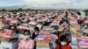 Flood survivors receive aid supplies provided by Cambodia&#39;s Prime Minister Hun Sen in Banteay Meanchey province.