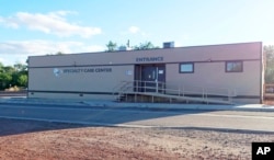 This June 2, 2019, photo shows the building that houses the cancer treatment center at a Tuba City, Ariz., hospital. (AP Photo/Felicia Fonseca)