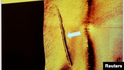 Sub-sea tracks left behind by a mini-submarine are seen in this undated sonar image. Sweden said it has proof that a small foreign submarine was operating illegally in its waters last month. The episode triggered the country's biggest military mobilizatio