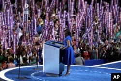 First Lady Michelle Obama speaks to delegates during the first day of the Democratic National Convention in Philadelphia , Monday, July 25, 2016. (AP Photo/John Locher)