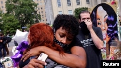 People react after a decision in the criminal case against police officers involved in the death of Breonna Taylor, who was shot dead by police in her apartment, in Louisville, Kentucky, U.S., September 23, 2020. REUTERS/Carlos Barria 