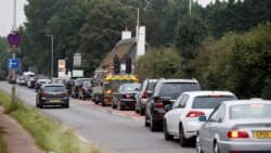 Vehicles queue to refill outside a Shell fuel station in Redbourn, Britain, Sept. 25, 2021.