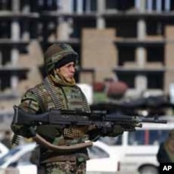 An Afghan National Army soldier keeps watch during clashes with protesters in Kabul.