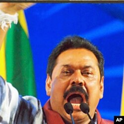 President Rajapaksa, behind bulletproof glass, addressing supporters, 24 Jan 2010